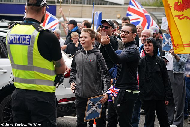 Children were among those attending a protest in Perth on Saturday and were seen jeering and making obscene hand gestures at counter-protesters