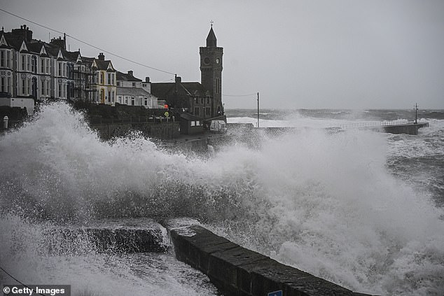 There are fears of huge waves which could hit Cornwall today. Pictured: Storm Herminia in Cornwall in January
