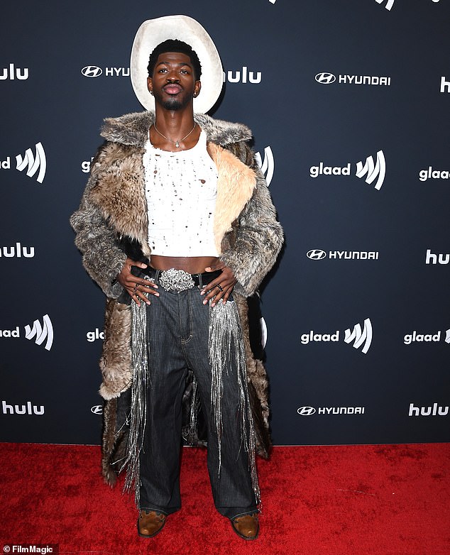A felony complaint obtained by the Daily Mail on August 25 shows Nas has been charged with three separate counts of battery with injury on a peace officer - referring to three alleged incidents with separate police officers;  Pictured In Beverly Hills in March
