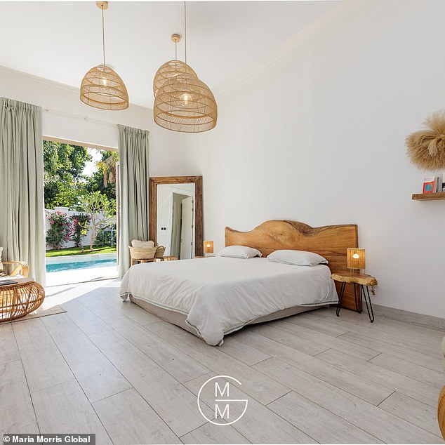 The main bedroom does come with a 'spa-inspired' bathroom, his-and-her walk-in closets and a balcony to enjoy the views of not only their lush garden but the far-reaching lake