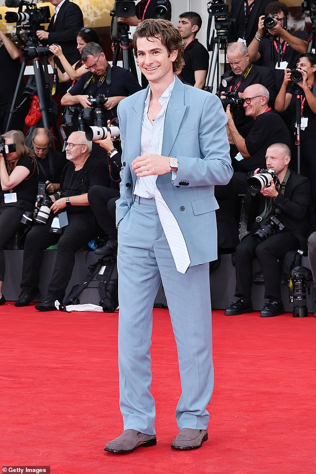 Andrew appeared in high spirits as he stepped out onto the red carpet wearing a pale blue two-piece suit