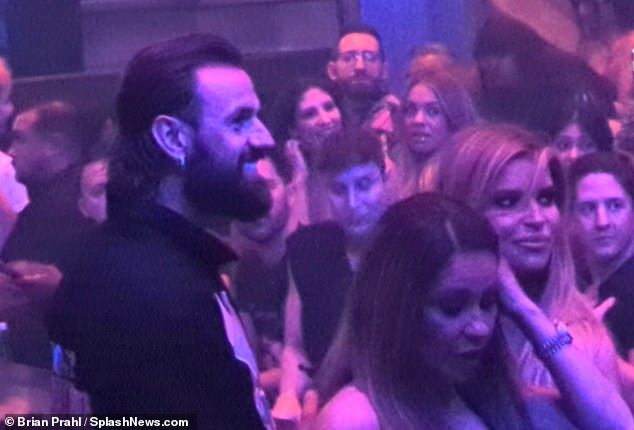 Her ex Eric was nowhere to be found as she danced to her sister's songs with the unidentified man by her side