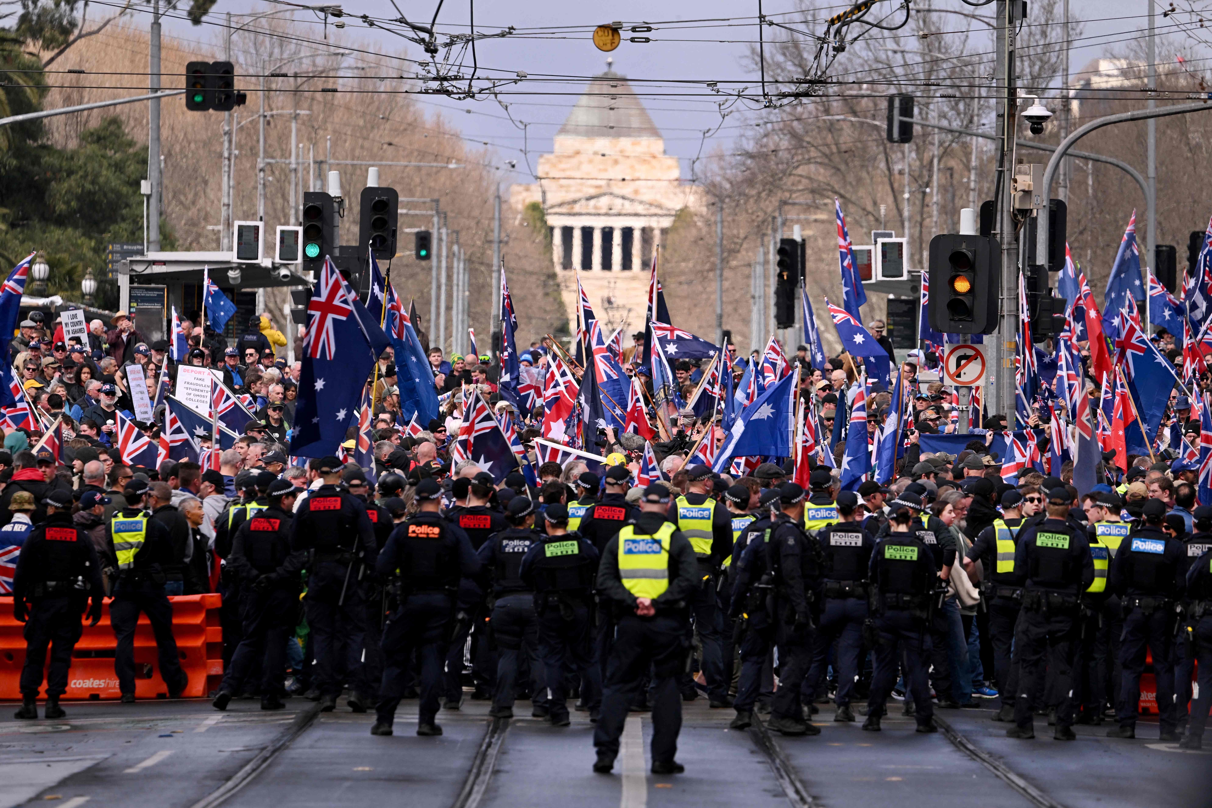 Protesters gather during a "March for Australia" anti-immigration rally in Melbourne on August 31, 2025.(AFP)