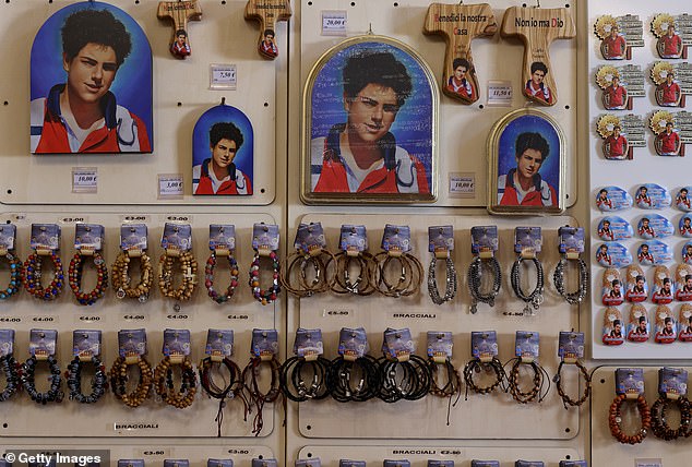 Souvenirs and mementos of the Blessed Carlo Acutis for sale in a shop in Assisi, March 18