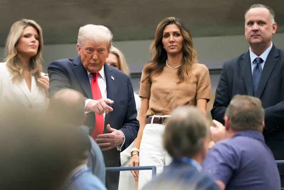 President Donald Trump reacts to spectators before the start of the men's singles final between Carlos Alcaraz, of Spain, and Jannik Sinner, of Italy, at the U.S. Open tennis championships, Sunday (AP)