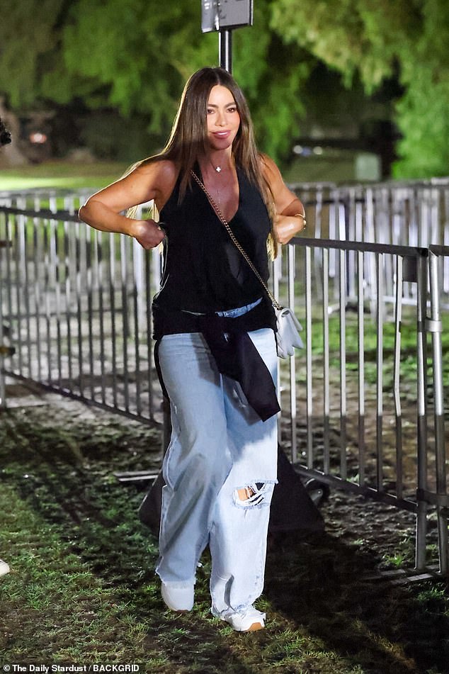 Meanwhile, Sofia Vergara, 53, opted for a plunging halterneck top and baggy, distressed jeans with holes in the knees