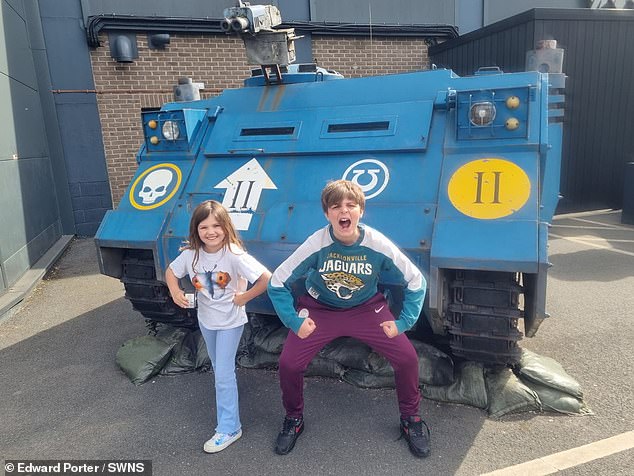 Ed says he can't see the family moving back to the UK anytime soon. Pictured: Elijah and Willow at Warhammer World in the UK