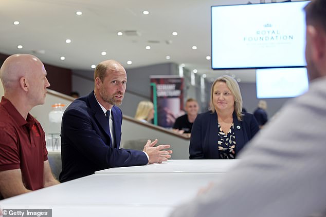 William sits next to Jac Lewis Foundation chief executive Elizabeth Thomas-Evans today