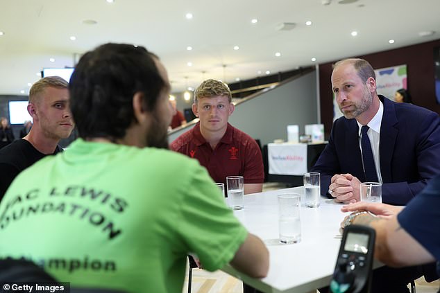 Prince William talks to members of the Welsh Rugby Union during his visit to Cardiff today