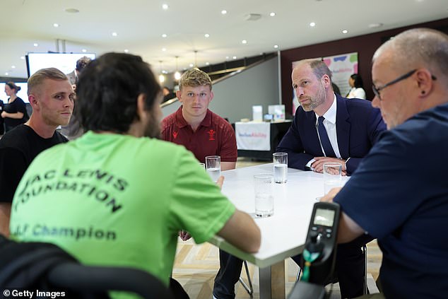 Prince William talks to members of the Welsh Rugby Union during his visit to Cardiff today