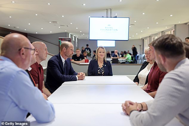 William sits next to Jac Lewis Foundation chief executive Elizabeth Thomas-Evans today