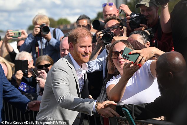 YESTERDAY: Prince Harry greets fans outside the Community Recording Studio in Nottingham