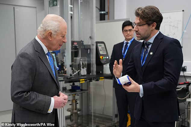King Charles is shown around a laboratory by researcher Spyros Masouros during his visit to the Centre for Injury Studies at Imperial College London
