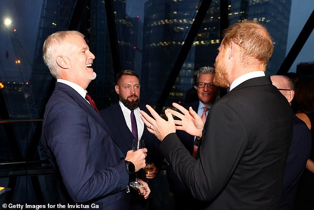 Prince Harry speaks with Al Carns Minister for the UK Armed Forces (L) & Ruslan Prykhodko, Deputy Minister of Ukrainian Veterans Affairs