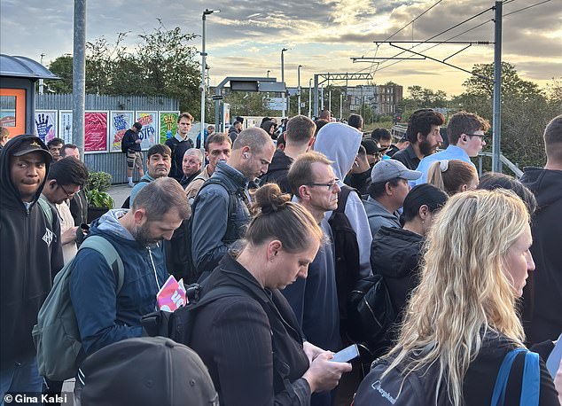 Passengers wait at Willesden Junction today for a Mildmay line train to Clapham Junction