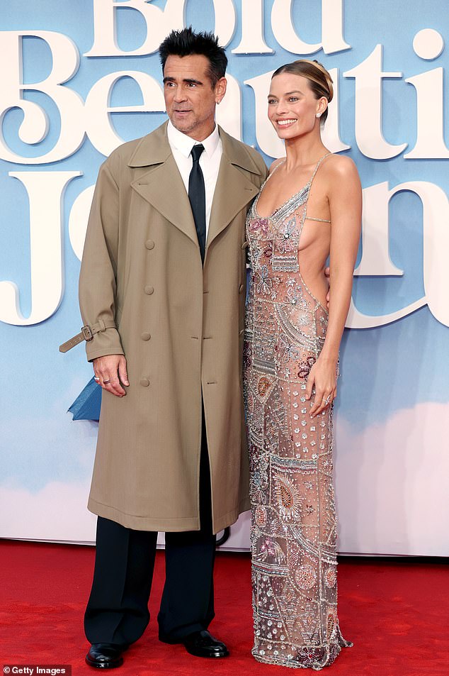 She also posed with Irish actor Colin, 49, for snaps as he channeled his inner Londoner with a trench coat over a black suit and tie