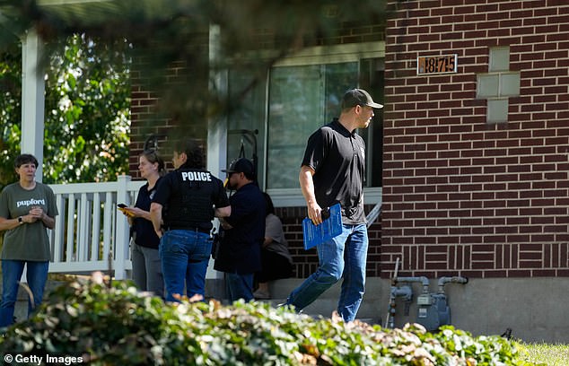 Investigators were continuing to comb through a neighborhood near the school on Thursday as the manhunt for the assassin continued