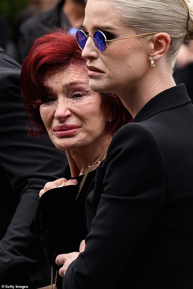 He was laid to rest the following week on the grounds of his mansion in Buckinghamshire (wife Sharon and daughter Kelly seen at his public funeral)