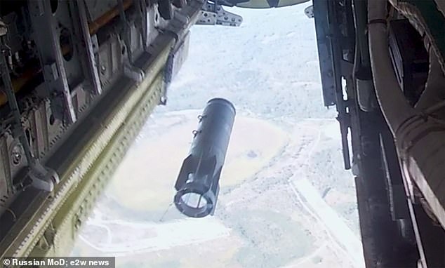 Footage (pictured) shows Kremlin long-range aviation forces carrying out an air strike on a 'simulated' enemy, with the aim of 'disrupting the control system and destroying critical objects'