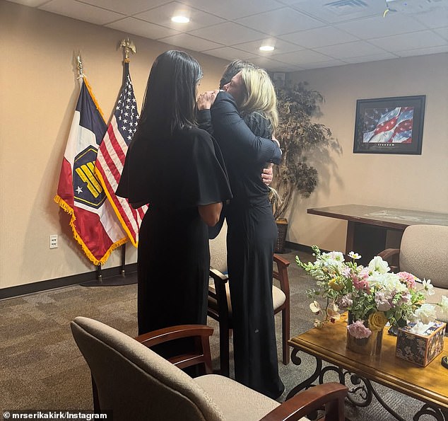 In another private moment, Erika Kirk can be seen being embraced by Vice President Vance. His wife, Usha, looks on