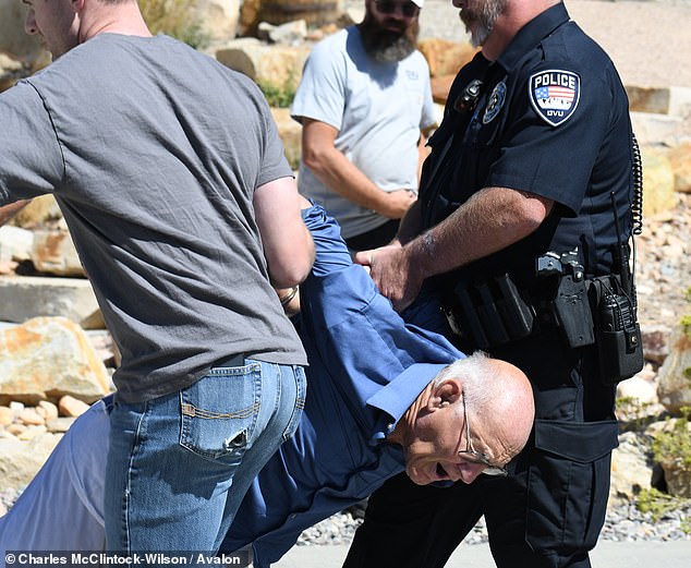 Police seen taking in a man as a suspect, who was later released