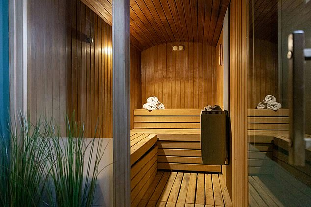 Beneath the grand hotel is a serene spa complete with a sauna (pictured)