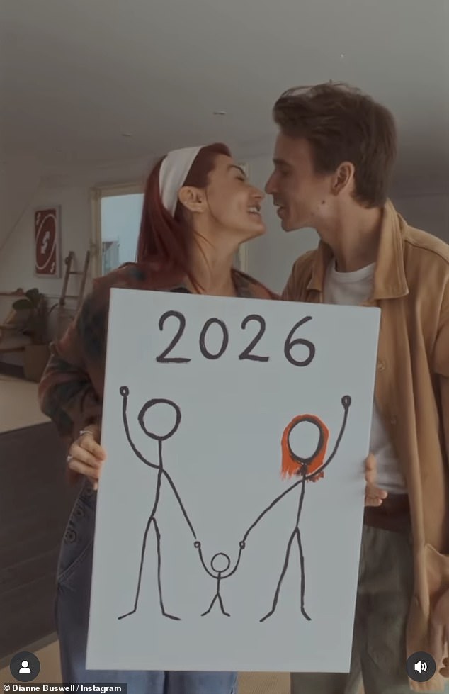 They then picked up the canvas to display it to the camera, revealing a drawing of two stickmen - one with Dianne's signature flaming red hair - holding hands with a baby