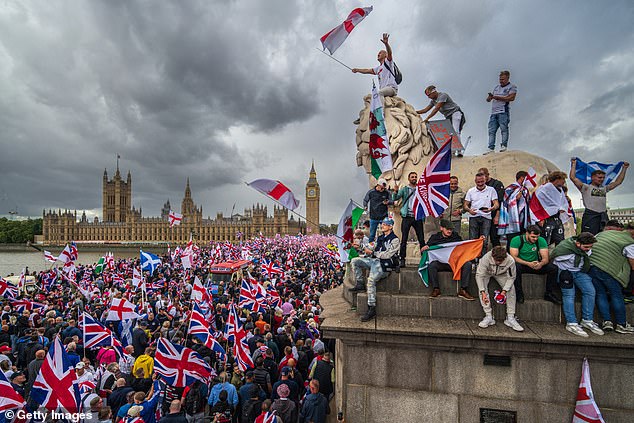 Protesters during the 'Unite The Kingdom' rally on Westminster Bridge on Saturday
