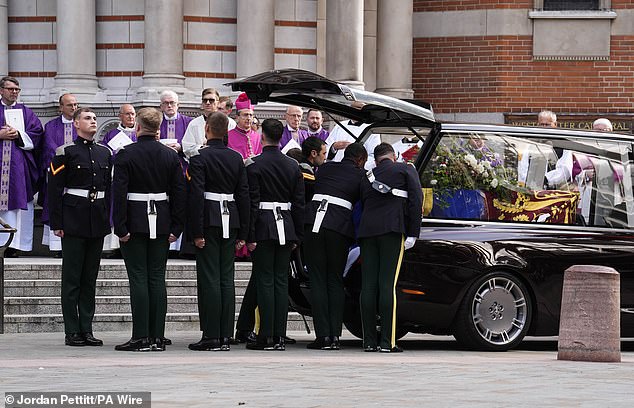 The coffin of the Duchess of Kent is carried out after her Requiem Mass service