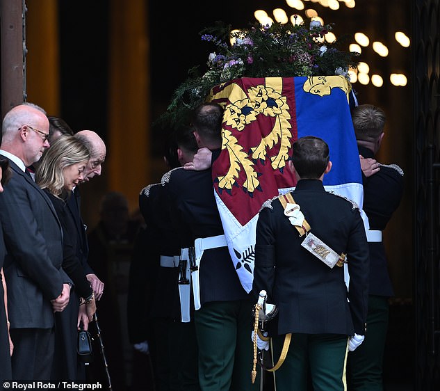 The Duke of Kent pictured bowing his head as the coffin enters Westminster Cathedral yesterday