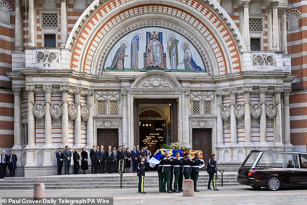 Royal Family members stand together as the coffin of the Duchess of Kent arrives yesterday