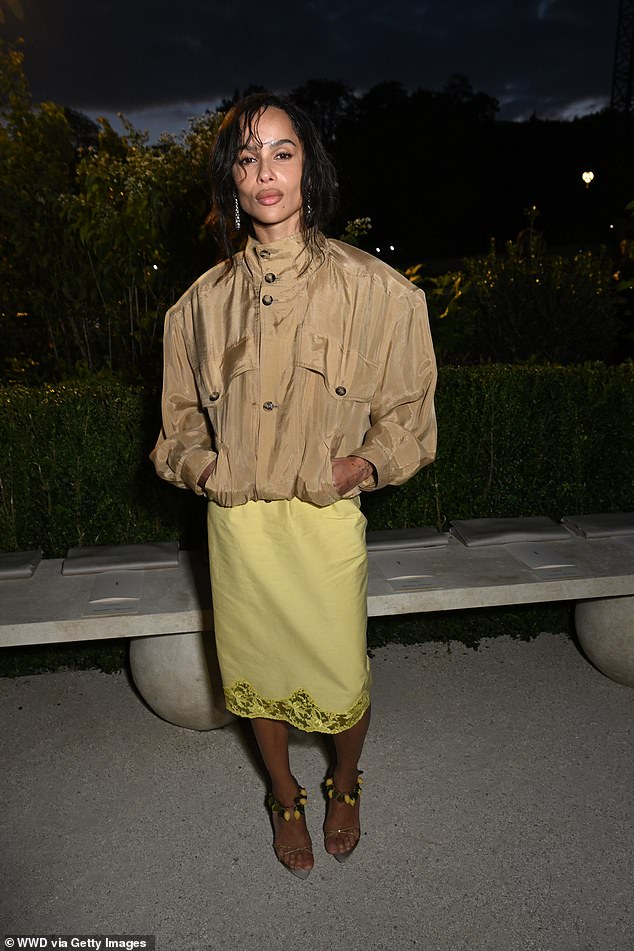 Zoe Kravitz opted for an oversized max jacket over a pale yellow and lace satin midi skirt