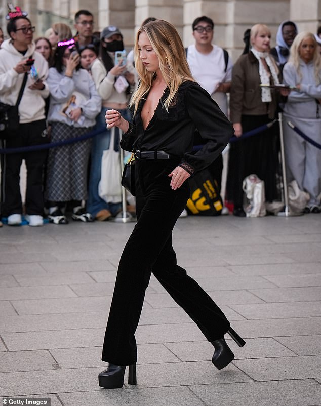 As she departed her hotel, Lila cut an elegant figure in her all-black look as she made her way to the Saint Laurent show