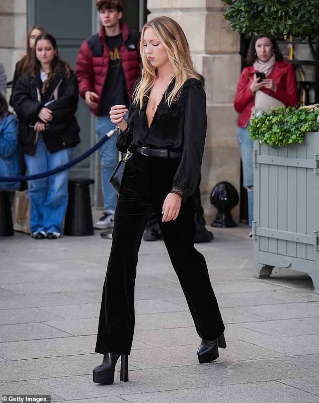 The young model teetered in chunky black platform boots as she headed to the fashion event