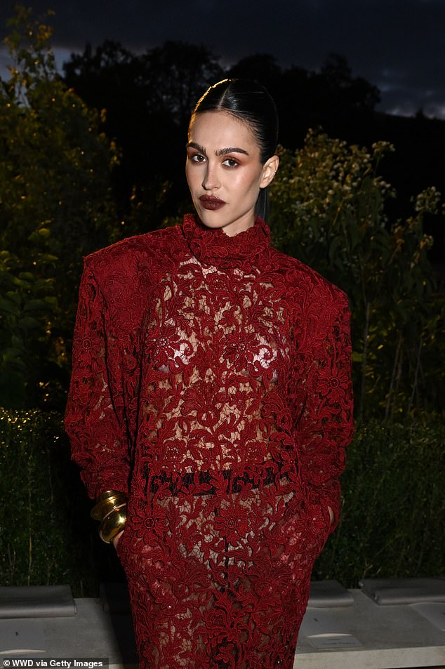 Amelia Gray Hamlin flashed a glimpse of her underwear in an incredibly daring sheer red lace dress, going braless in the sexy look