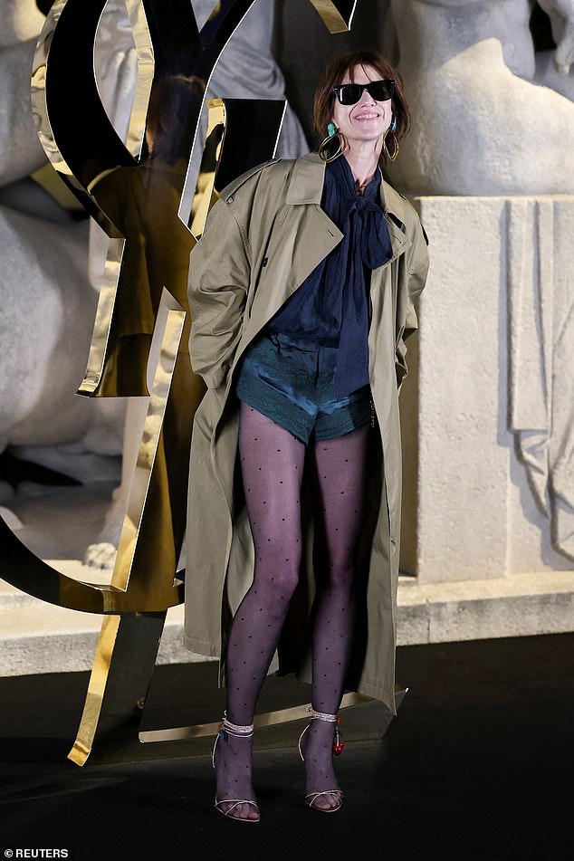 Charlotte Gainsbourg put on a leggy display in dark green lace hot pants, teamed with a navy blue pussybow blouse