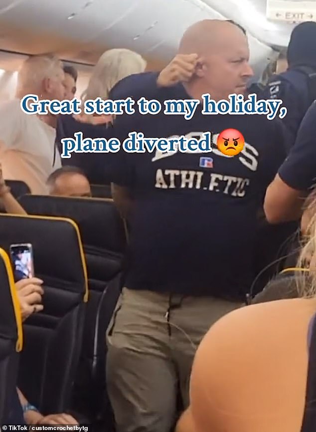 Another video showed Ashley-Laws being dragged away by his ear by a cop on board the flight