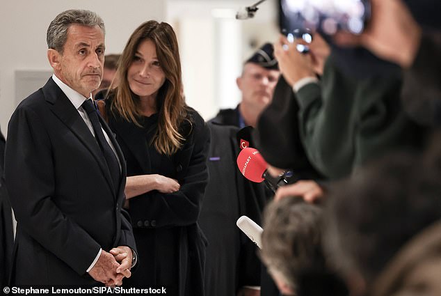 Bruni stood by her husband's side as he delivered a speech after his conviction. A biographer has said she will visit her husband every day throughout his sentence
