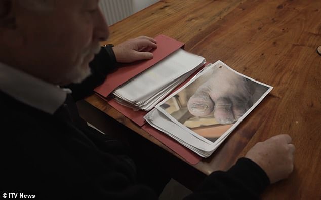 Steven's father John looks at his dossier compiling the abuses his son was subject to at a Liveways-run residential home