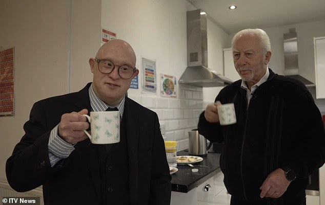 Steven Baskin (left), who has Down's Syndrome, pictured having a cup of tea with his father John (right)
