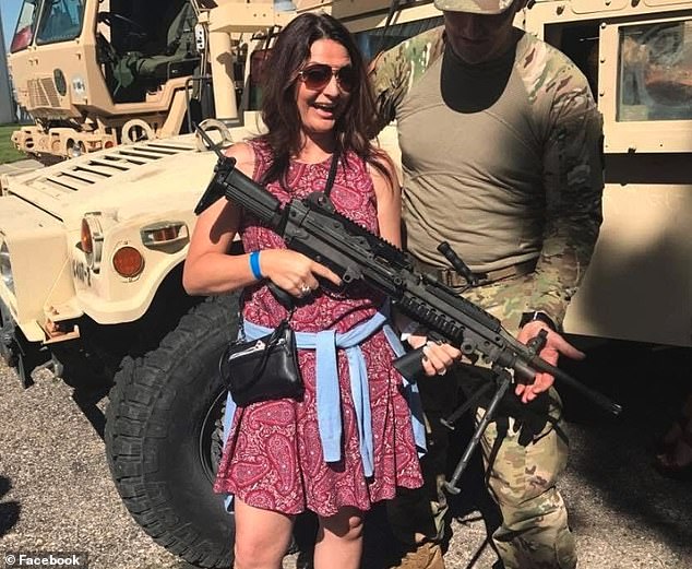 The alleged assassin's mother Amber seen with a machine gun