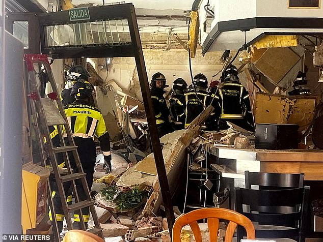 Doors had been ripped off their hinges, with shards of glass scattered on the road outside, while first responders whisked away a victim on a stretcher