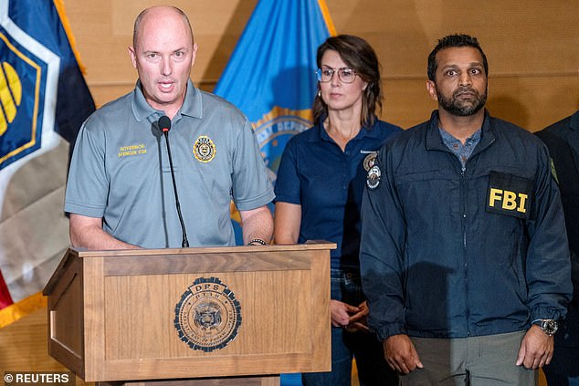 Utah Governor Spencer Cox speaks at a press conference, near FBI Director Kash Patel, at the Utah Valley University, after U.S. right-wing activist and commentator, Charlie Kirk, an ally of U.S. President Donald Trump, was fatally shot during an event at the university, in Orem, Utah, U.S. September 11, 2025. REUTERS/Cheney Orr     TPX IMAGES OF THE DAY