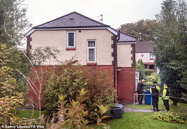 Police officers were at the property carrying out searches on Friday, with neighbours telling the Mail they often saw the attacker working out in the garden