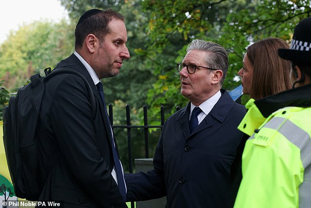 Prime Minister Sir Keir Starmer and Lady Victoria Starmer speak with a member of the Jewish community at the scene of yesterday's terror attack