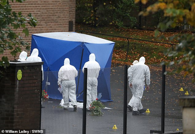 Forensic officers work at the Heaton Park Hebrew Congregation Synagogue on Friday