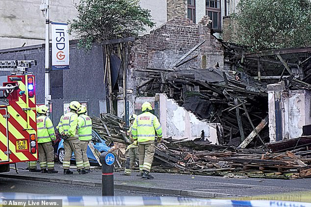 A building collapsed onto a car in Glasgow, Scotland, on Friday afternoon