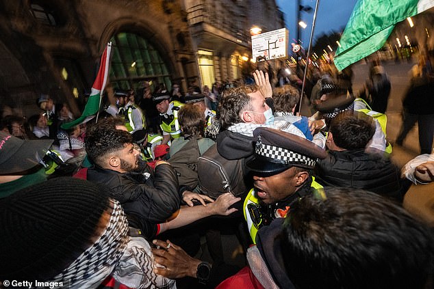 Police clash with protesters at the south end of Whitehall following a protest in Parliament square on Thursday