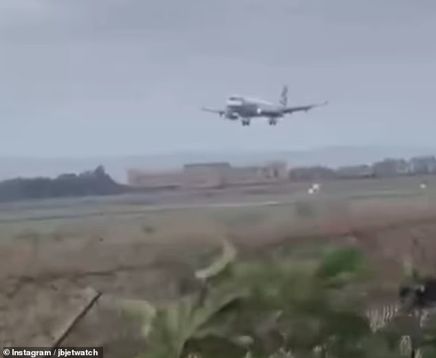 Footage taken by a plane watcher on the ground shows the plane approaching the runway before the blustery winds threatened to blow it off course and the pilot ascended again