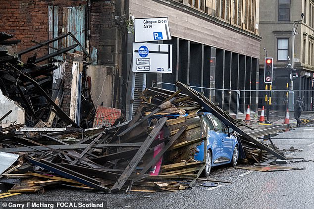A building collapsed in Broomielaw, in Glasgow, Scotland, covering a car in debris